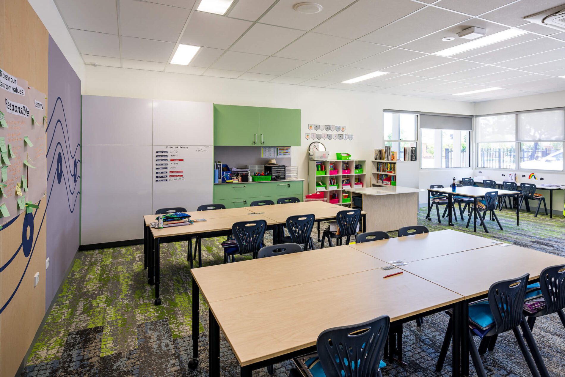 General learning area with colourful laminate storage, tables and chairs