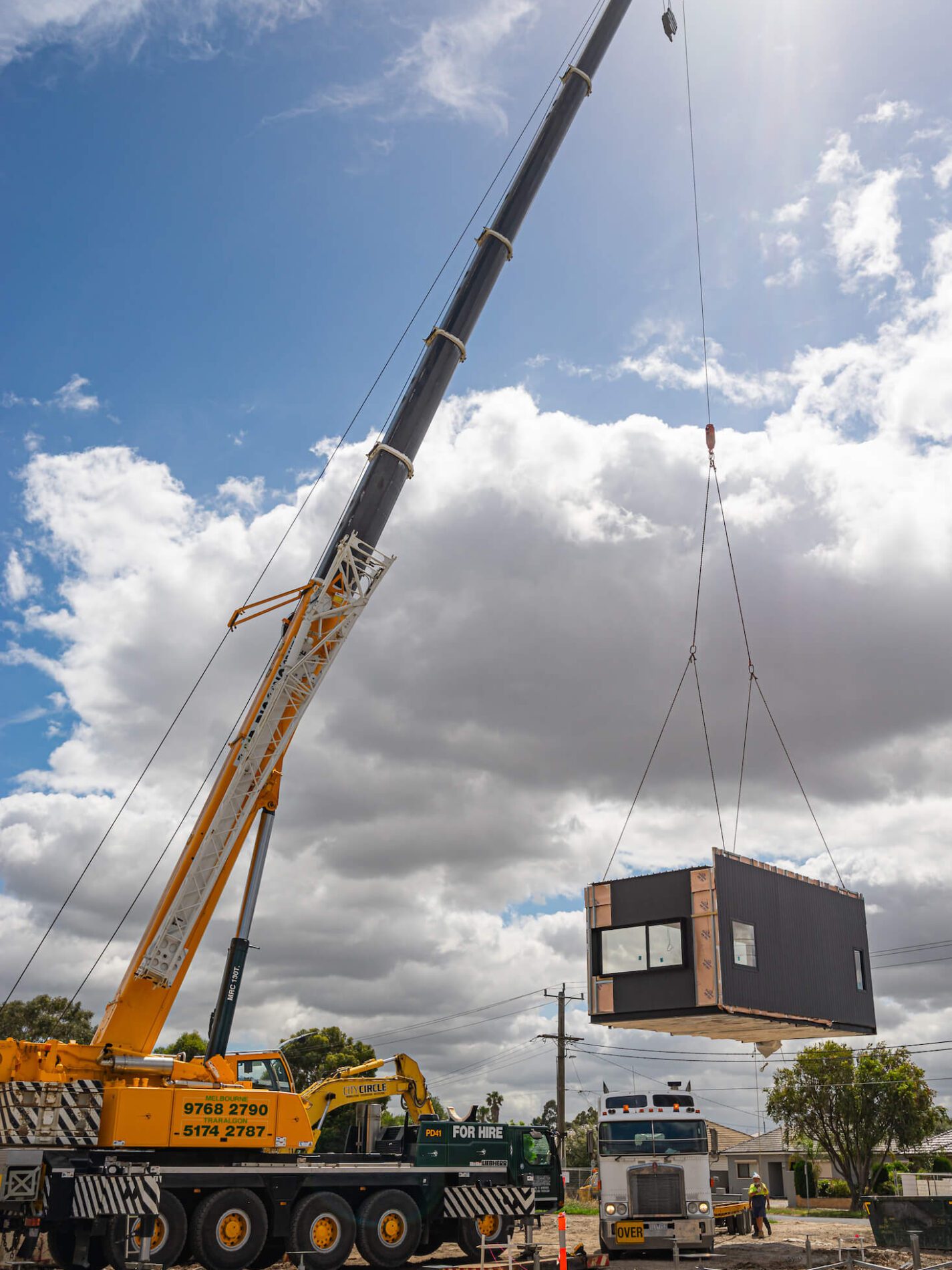 Crane lowers permanent modular building onto school site