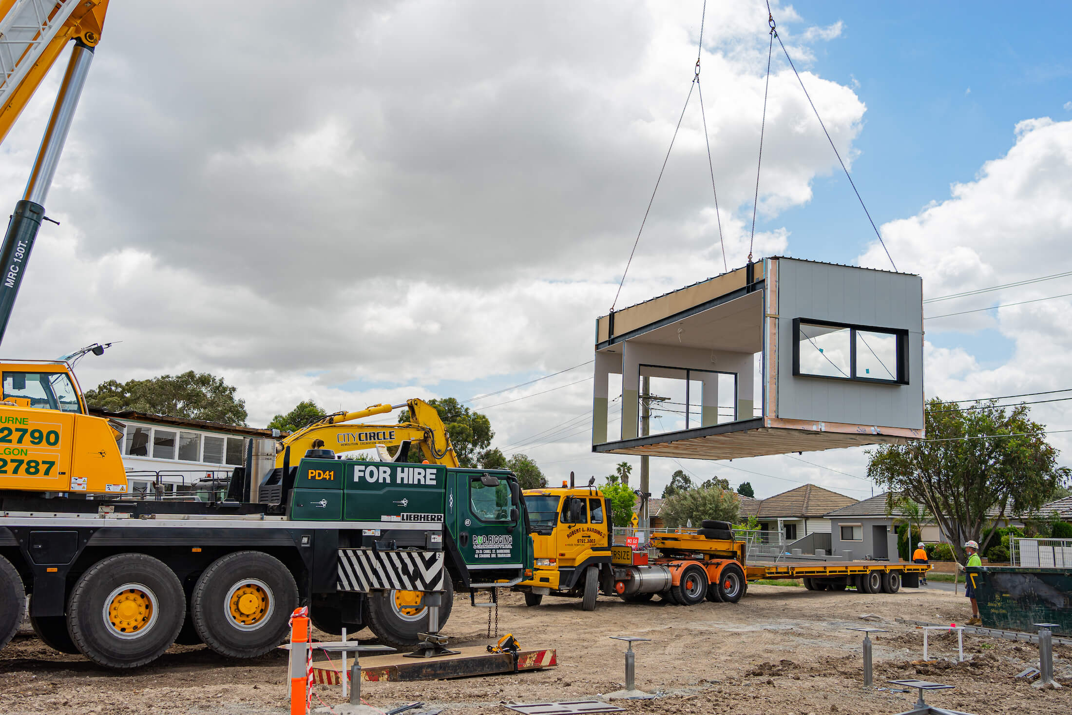 Crane lowers permanent modular school building onto site