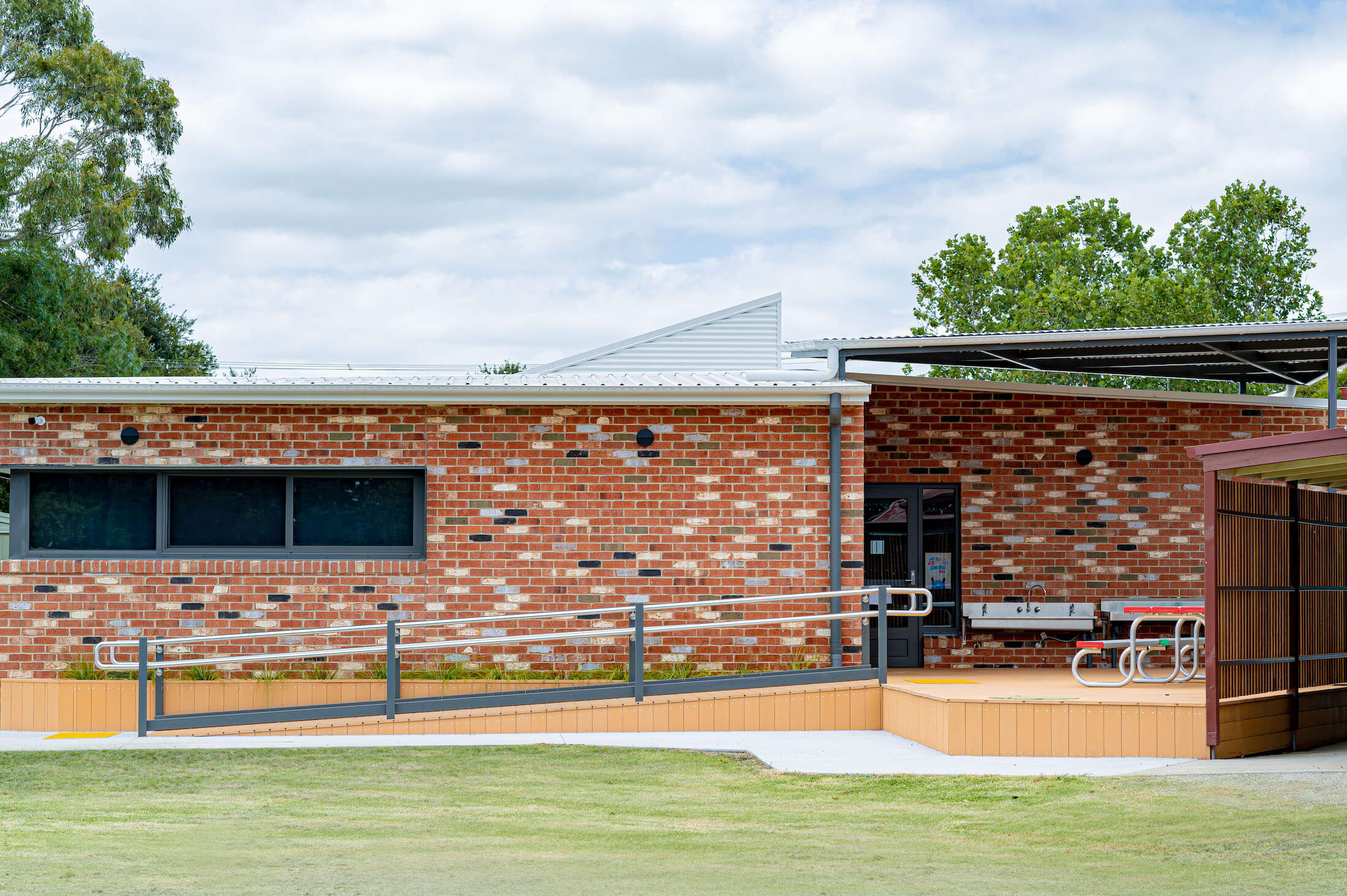 Brick permanent modular building and entry ramp at Cowwarr Primary School