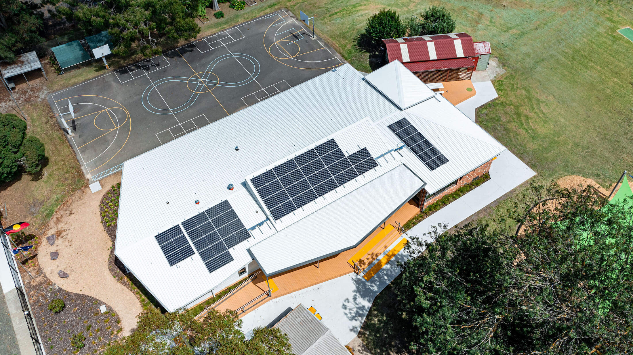 Aerial shot of finished permanent modular building and basketball court at Cowwarr Primary School
