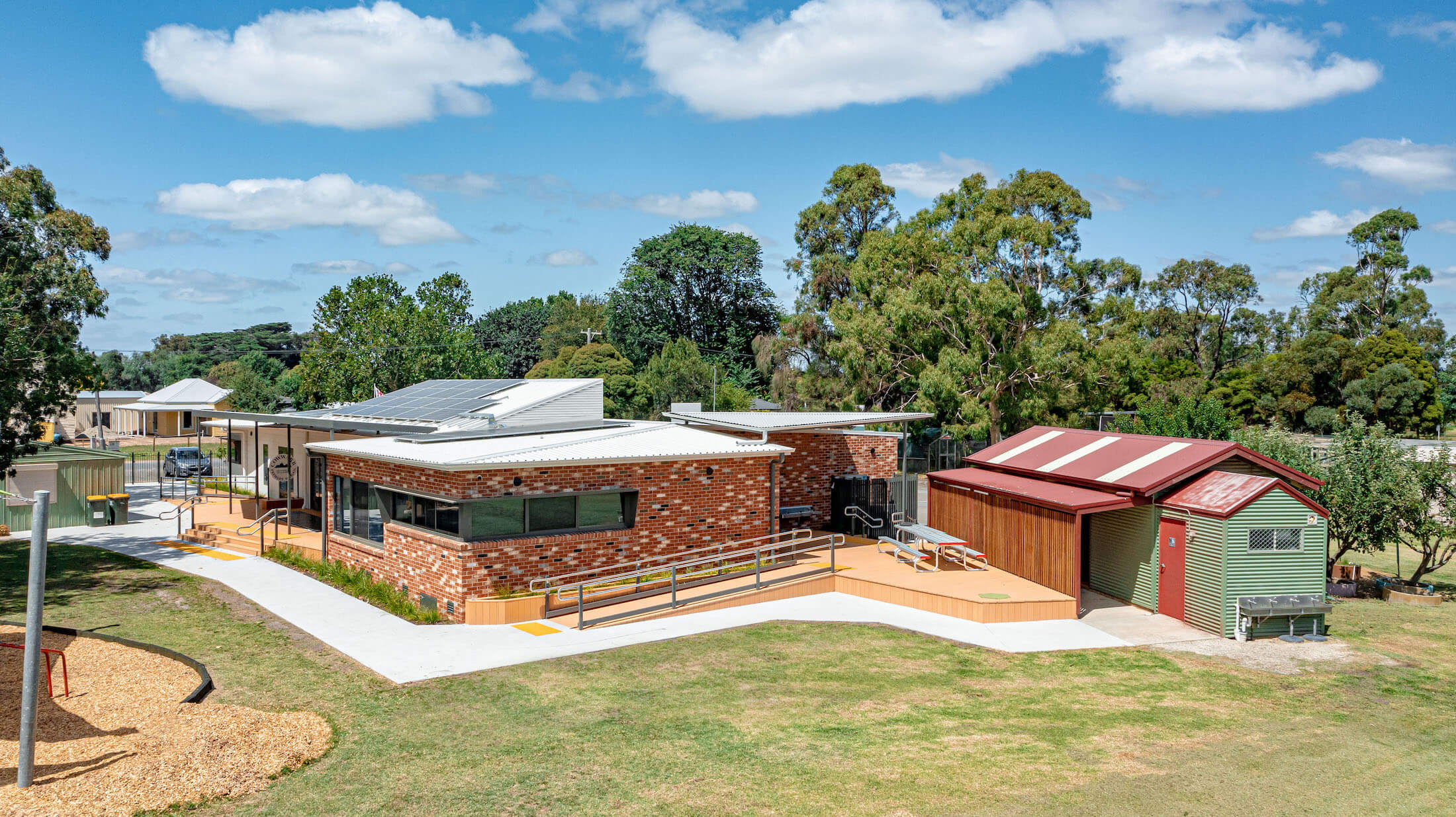 New brick school, elevated view, plus outbuilding at Cowwarr Primary School