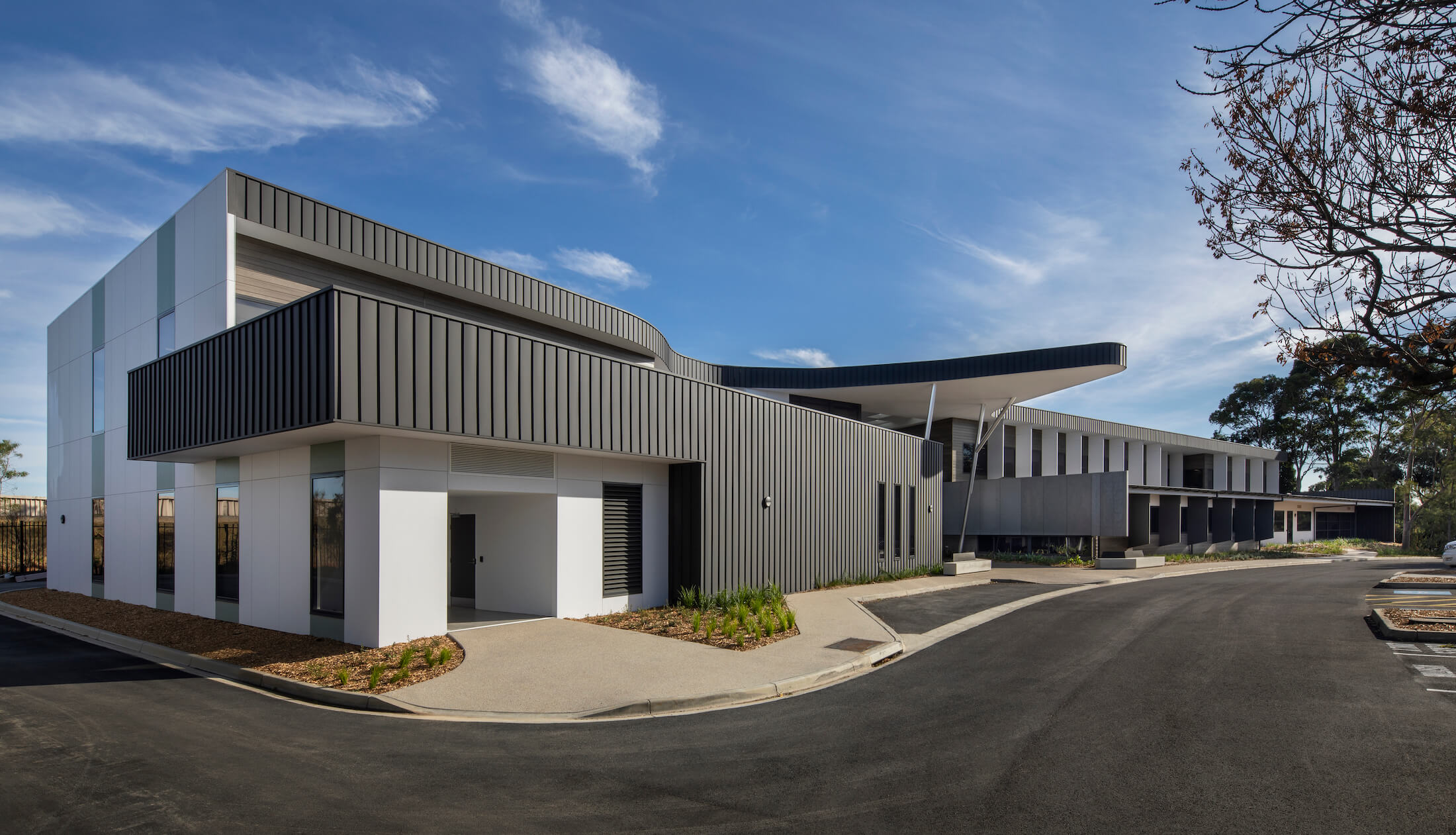 Standing seam metal cladding on large police training facility