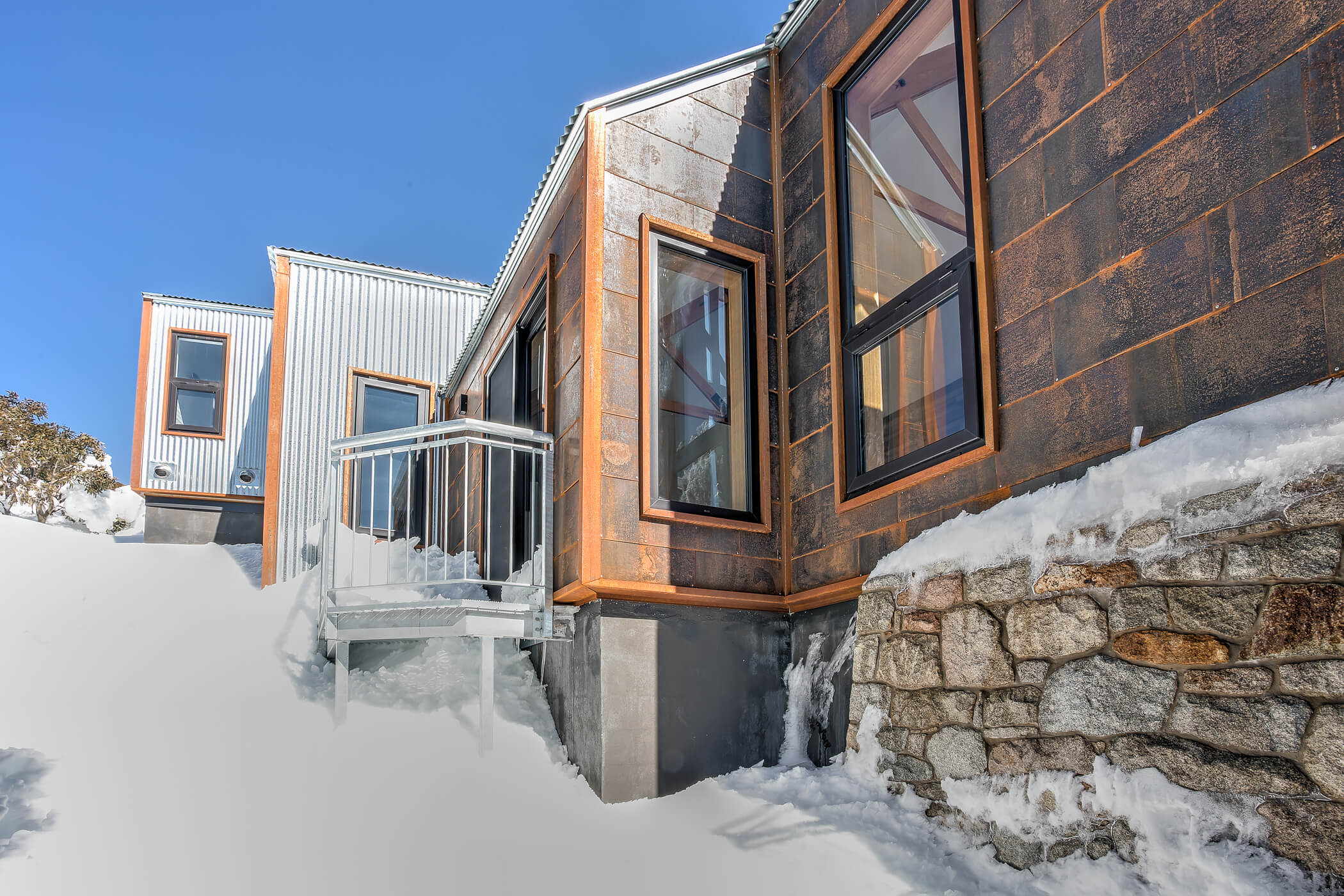 Chalet external view, metal cladding and snow