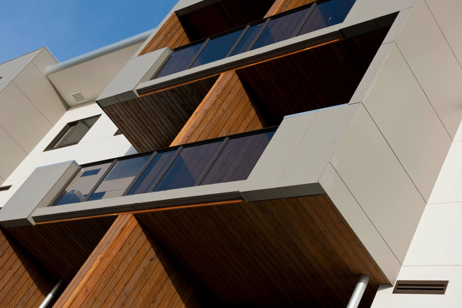 New apartment balconies with timber and fibre cement sheet cladding