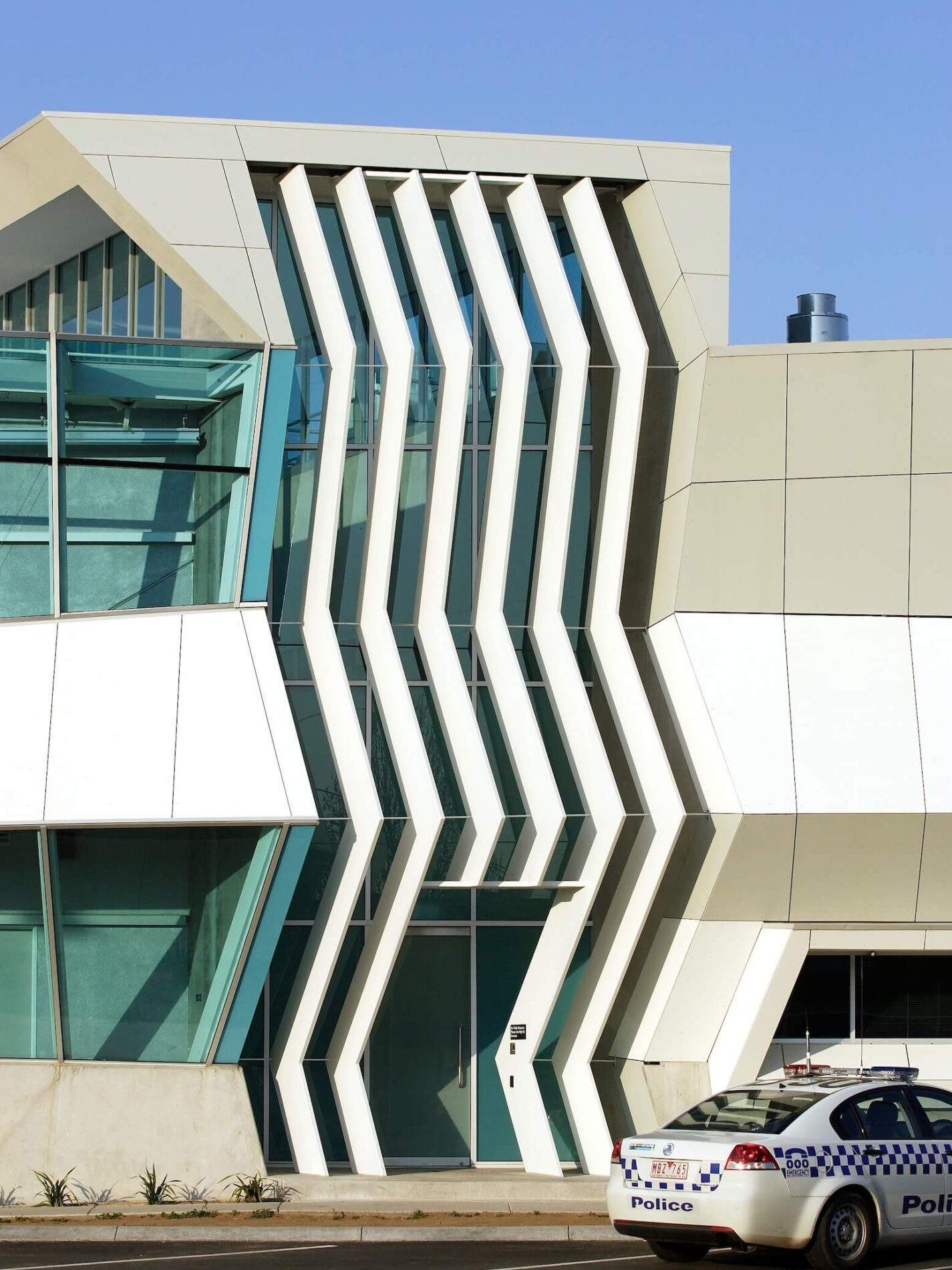 Zig zag effect of vertical metal fins and cladding on police complex