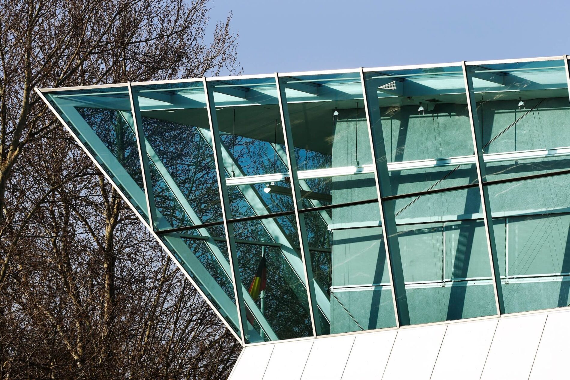 Angled glazing on double facade of police station complex