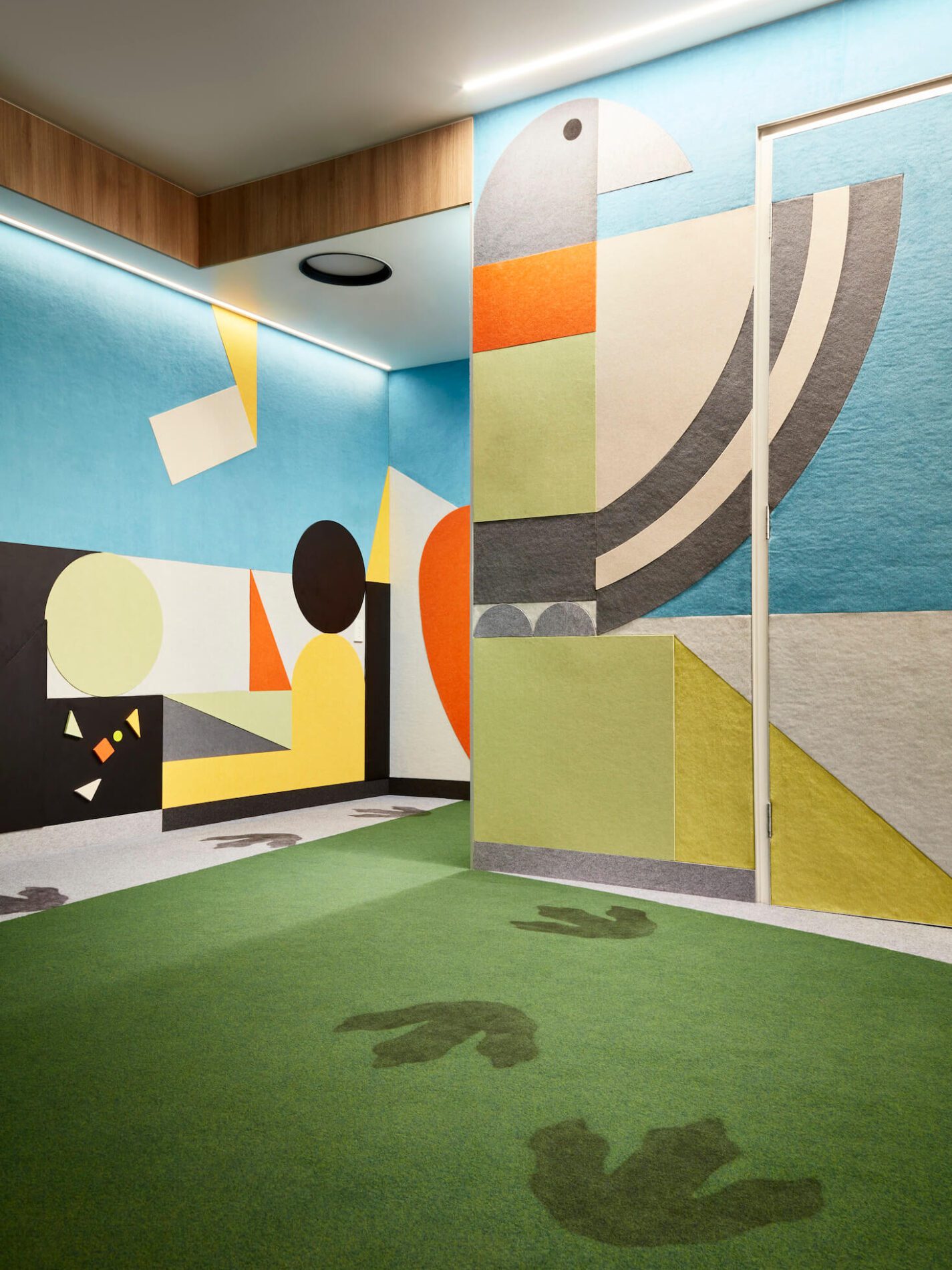 Felt eagle design on walls leading into children's cubby at Children's Court of Victoria