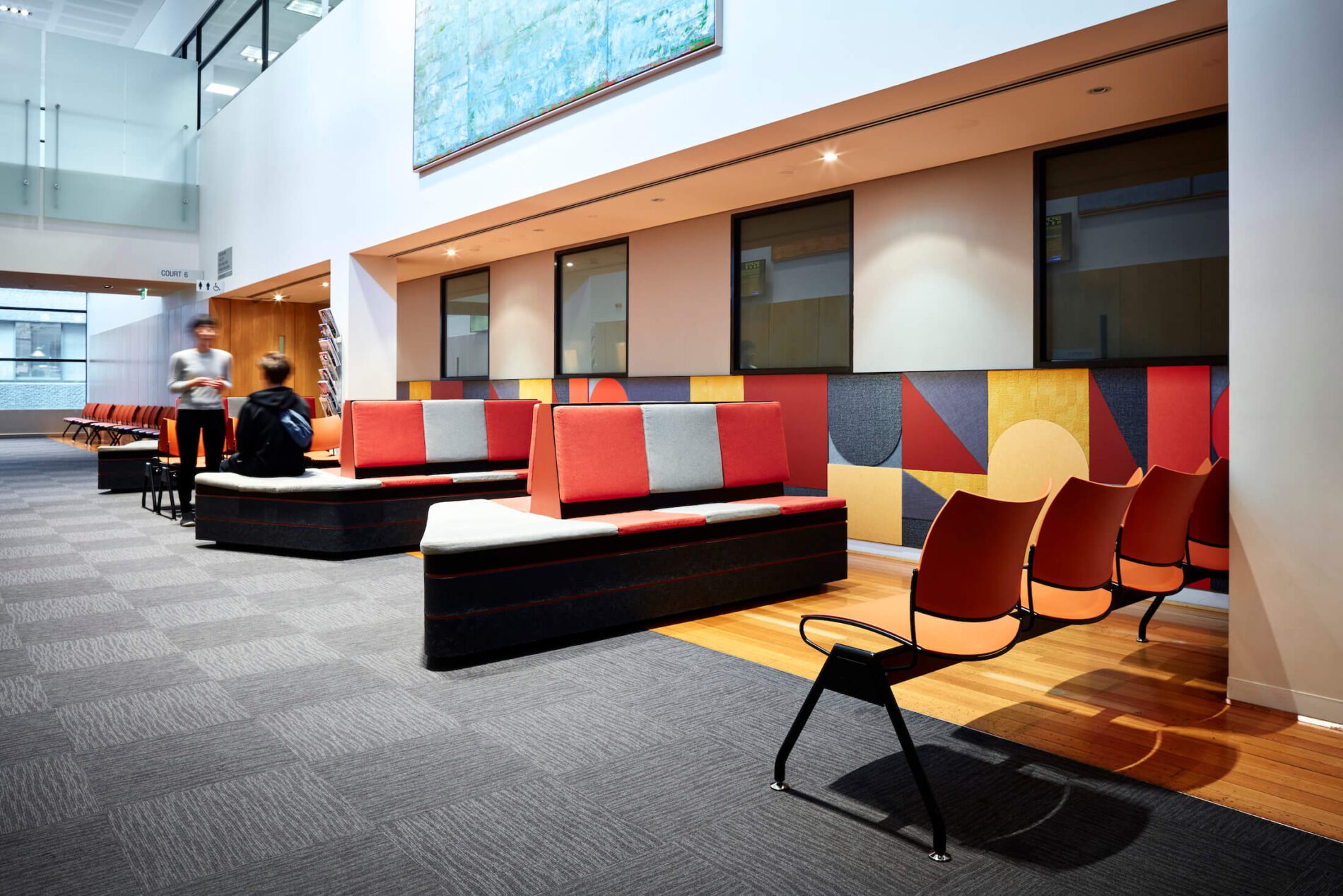 Colourful acoustic panels and chairs in waiting area