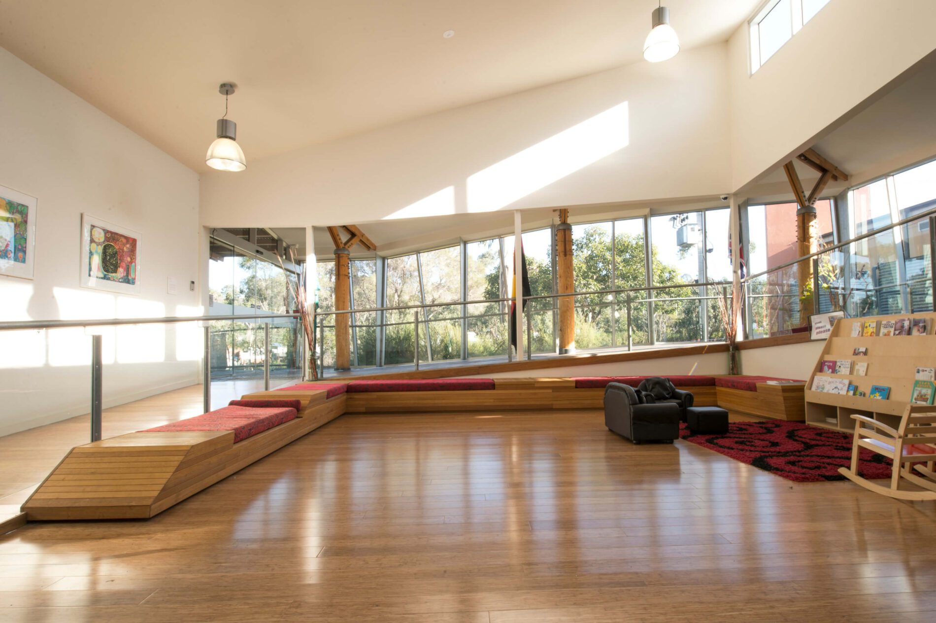Bright community space with natural light and timber floors