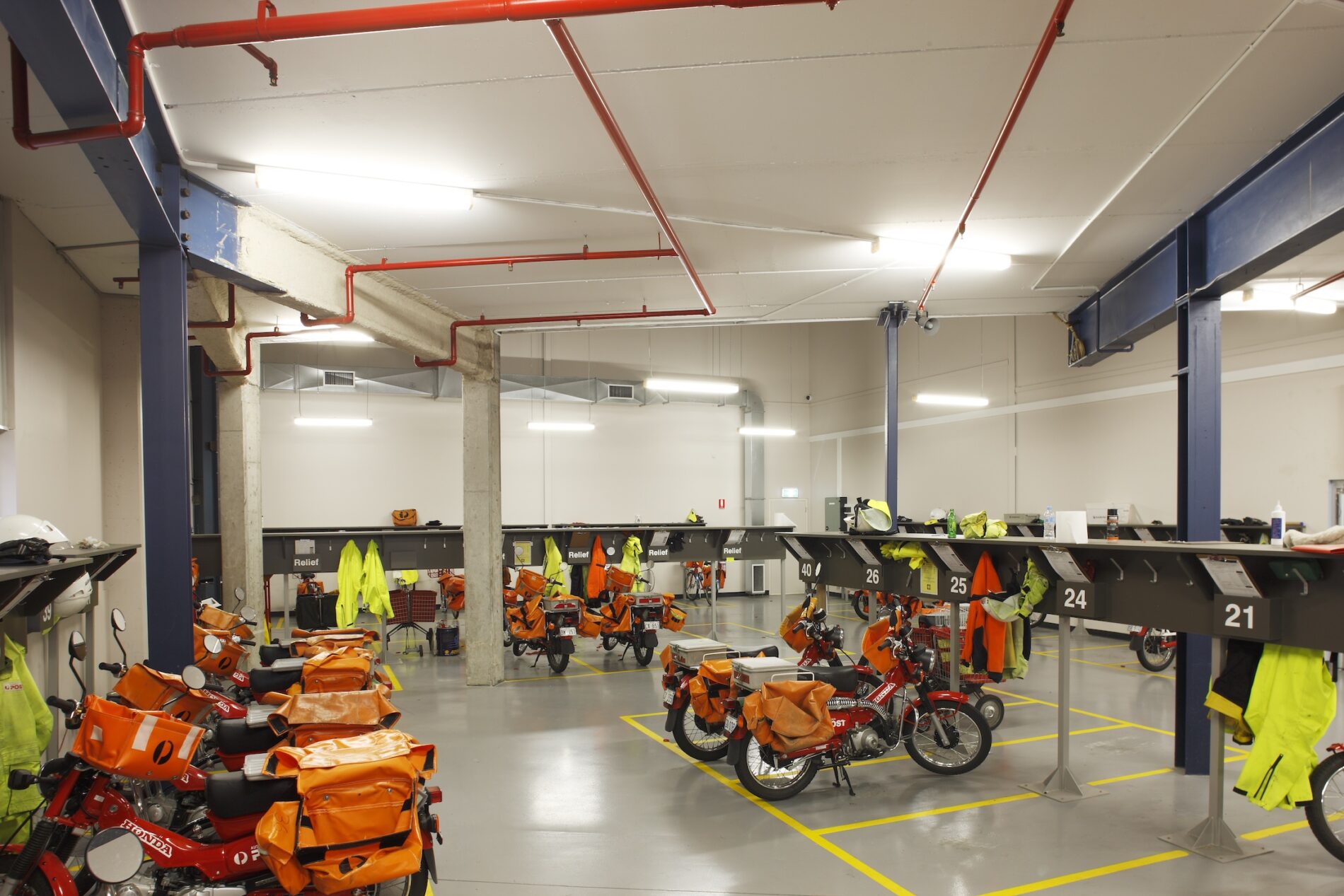 Australia Post motorbike fleet parking bays in warehouse