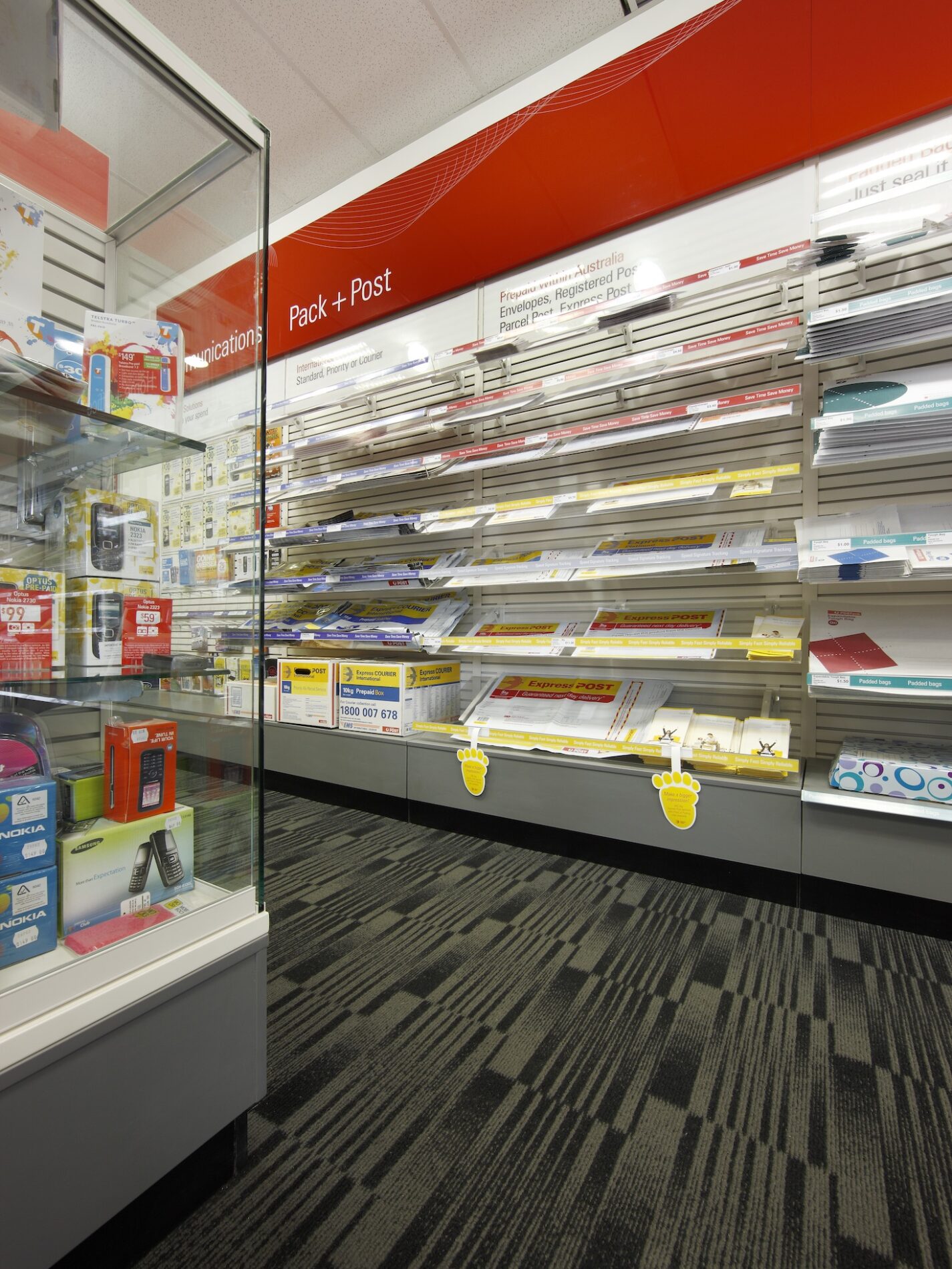 Australia Post shop with pack and post shelving and glass display cabinet